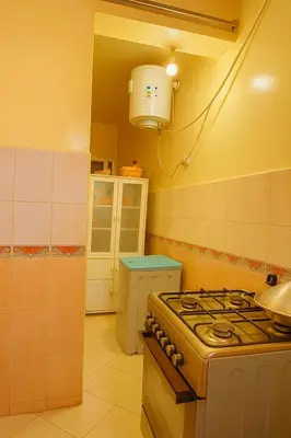 a kitchen with a stove and a sink at Your favorite stay - 5min to M avenue & Gueliz in Marrakech