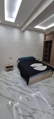 a bedroom with a large bed in a room at Havre de paix en plein Marrakech in Marrakech