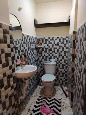 a bathroom with a toilet and a sink at غرفه هادئه في موقع رائع وقريبه من كولشي in Marrakech