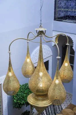 a group of four lights hanging from a chandelier at Riad Authentique en Exclusivité in Marrakech