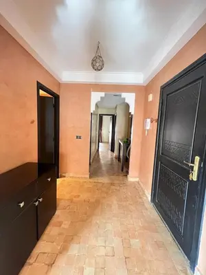 an empty hallway with a black door and a hallway with a hallwayngth at Appartement PREMIUM VILLAGE in Marrakech
