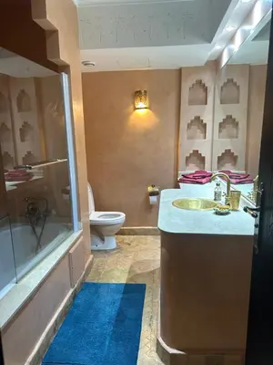 a bathroom with a sink and a shower and a toilet at Appartement PREMIUM VILLAGE in Marrakech