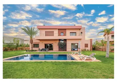 a house with a swimming pool in front of it at VILLA Lavande Jacuzzi, Cuisinière, Piscine in Marrakech