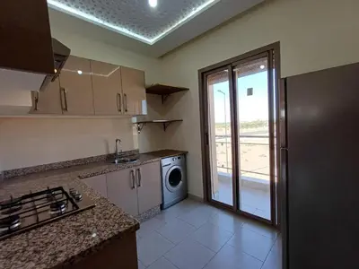 a kitchen with a washer and dryer in a room at Villa Targa in Marrakech