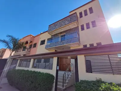 a large house with a staircase in front of it at Villa Targa in Marrakech