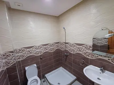 a bathroom with a toilet and a sink at Villa Targa in Marrakech