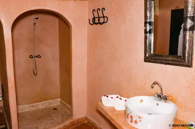 a bathroom with a sink and a shower at Riad Mounir in Marrakech