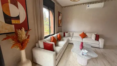 a living room with a white couch and a table at Villa Palmera - 6 people - Pool - Marrakech in Marrakech