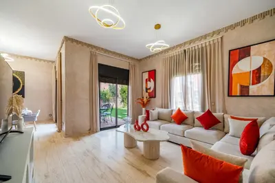 a living room with a couch and a table at Villa Palmera - 6 people - Pool - Marrakech in Marrakech