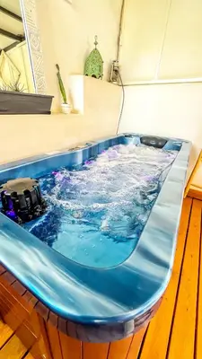 a large jacuzzi tub in a room at Ma petite maison cosy en medina in Marrakech