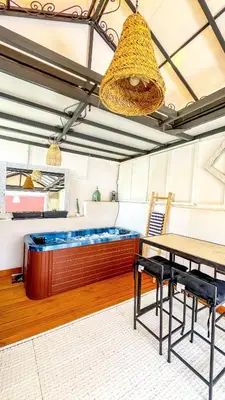 a room with a bed and a table and chairs at Ma petite maison cosy en medina in Marrakech