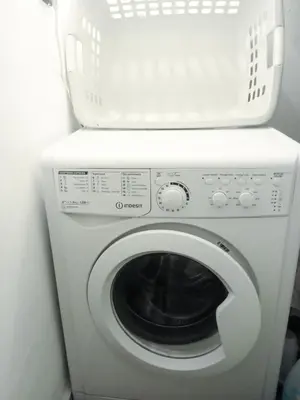 a white washer and dryer in a room at Ma petite maison cosy en medina in Marrakech