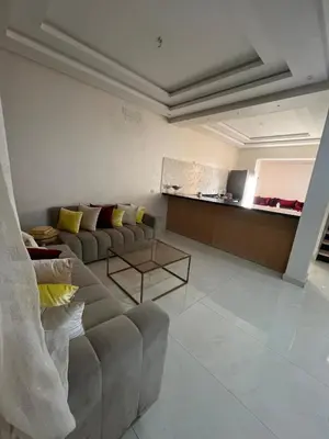 a living room with a couch and a table at Villa Marrakech in Marrakech