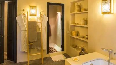a bathroom with a shower and a sink at Dar-el-adaka in Marrakech