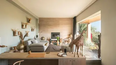 a living room with a giraffe statue on a table at Dar-el-adaka in Marrakech