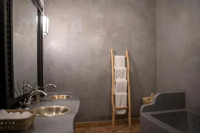 a bathroom with two sinks and a towel ladder at Villa Sidi Oasis in Marrakech