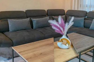 a living room with a couch and a table at The Garden Course - Marrakech - Prestigia in Marrakech