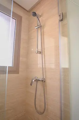 a shower with a glass door in a bathroom at The Garden Course - Marrakech - Prestigia in Marrakech