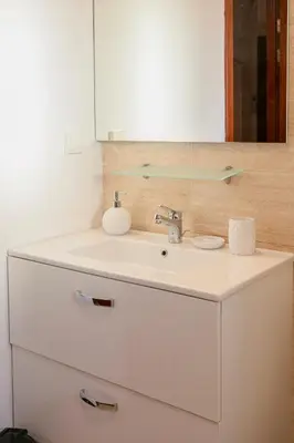 a bathroom with a sink and a mirror at The Garden Course - Marrakech - Prestigia in Marrakech