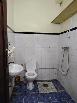 a bathroom with a toilet and a sink at Maison traditionnelle marocaine à Marrakech in Marrakech