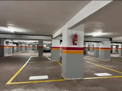 an empty parking garage with a car parked in it at Appartement Miramas 2 E2 in Marrakech