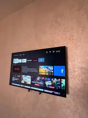 a flat screen tv hanging on a wall at Marrakesh cozy apartment 15mn city center in Marrakech