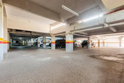 an empty parking garage with cars parked in it at Confort et style en pleins centre de Hivernage in Marrakech