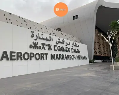 a sign on the side of a building at The Medina Touch - Marrakech in Marrakech