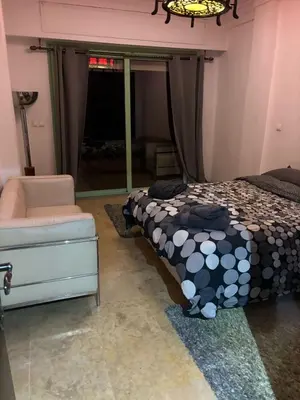 a bedroom with a bed and a window at Chez Houda in Marrakech