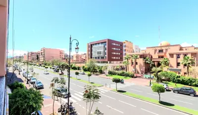 a view of a city street with cars on the road at Residence Jnan Atlas gueliz in Marrakech