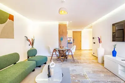 a living room with a couch and a table at Stylish modern 1BR in gueliz in Marrakech