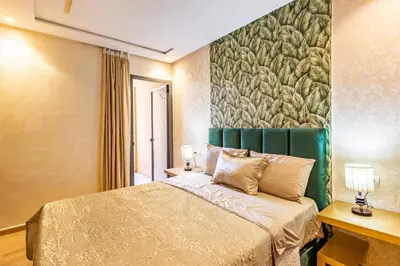 a bedroom with a bed and a large painting on the wall at 5 Stars Home with Pool & Parking in Marrakech