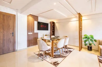 a dining room with a table and chairs at 5 Stars Home with Pool & Parking in Marrakech