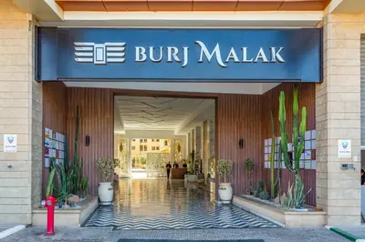 a building with a sign on the front of it at 5 Stars Home with Pool & Parking in Marrakech