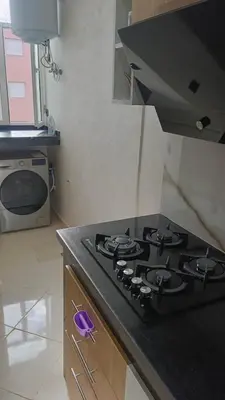 a kitchen with a black stove top in a kitchen at marrakech premium village c18 in Marrakech