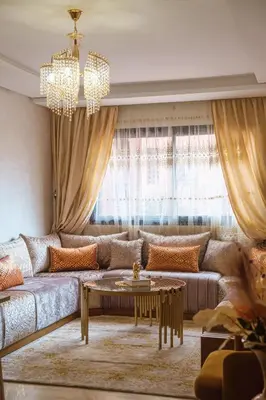 a living room with a couch and a table at Luxe 2-Bedroom with Pool in Marrakech in Marrakech