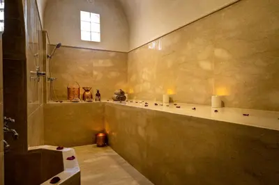 a large bathroom with a shower and a sink at Riad Malaika in Marrakech