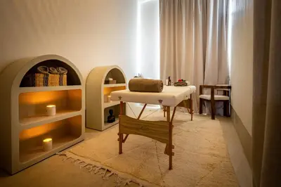 a room with a table and shelves with candles at Riad Malaika in Marrakech