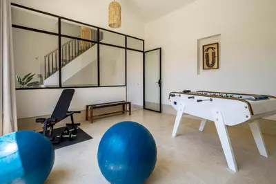 a living room with a pool table and blue balls at Riad Malaika in Marrakech