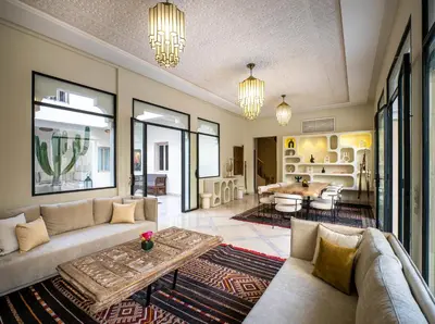 a living room with a couch and a table at Riad Malaika in Marrakech