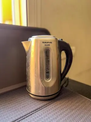 a kettle sitting on top of a table at Apartment with pool in Guéliz Hadika al koubra in Marrakech