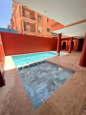a swimming pool on the side of a building at Gueliz -La Kasbah AC oneBedroom Apart with parking in Marrakech