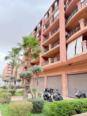 two motorcycles parked in front of a building at Gueliz -La Kasbah AC oneBedroom Apart with parking in Marrakech