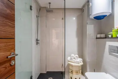 a bathroom with a shower and a toilet and a sink at Appartement in Marrakech in Marrakech
