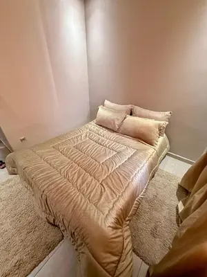 a bed with two pillows on it in a room at Appartement moderne dans Marrakech in Marrakech