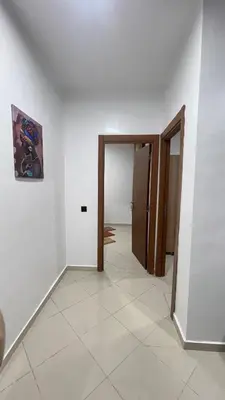 an empty room with a hallway with two doors at Dar al Montazah in Marrakech