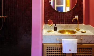 a bathroom with a sink and a mirror at Amanar Marrakech Boutique Hotel & Riad in Marrakech