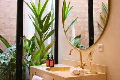 a bathroom with a sink and a mirror at Amanar Marrakech Boutique Hotel & Riad in Marrakech