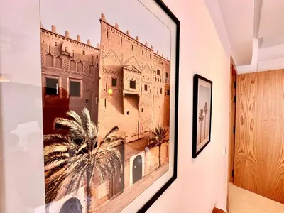 a picture hanging on a wall in a hallway at Elegant & Cosy Cocoon in Central Gueliz in Marrakech