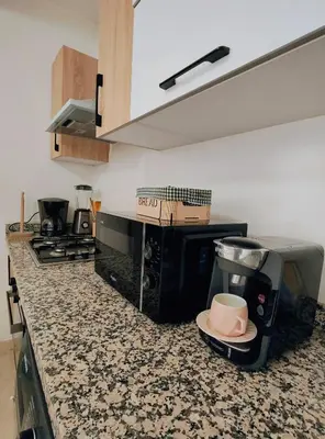 a kitchen with a coffee maker on a counter at Studio cosy avec piscine à Gueliz in Marrakech